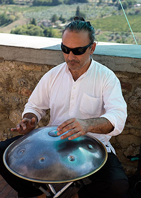 Amayur playing the PanART Hang drum in San Gimignano, Italy